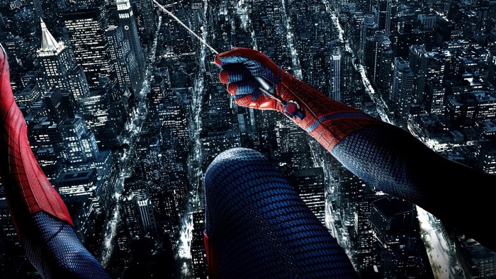 Spider-Man swinging through a city at night