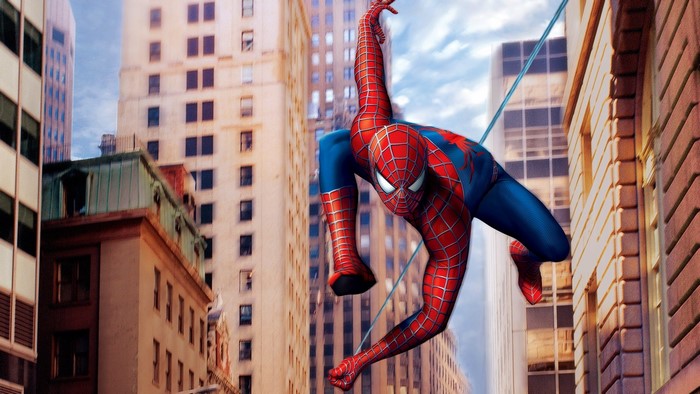 Spiderman swinging between buildings