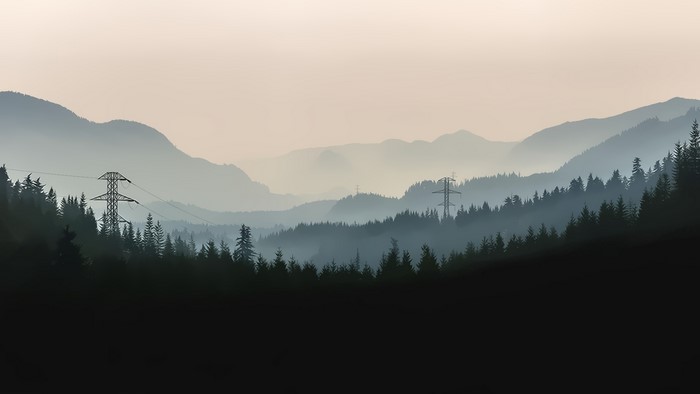 Misty mountains with power lines and forest