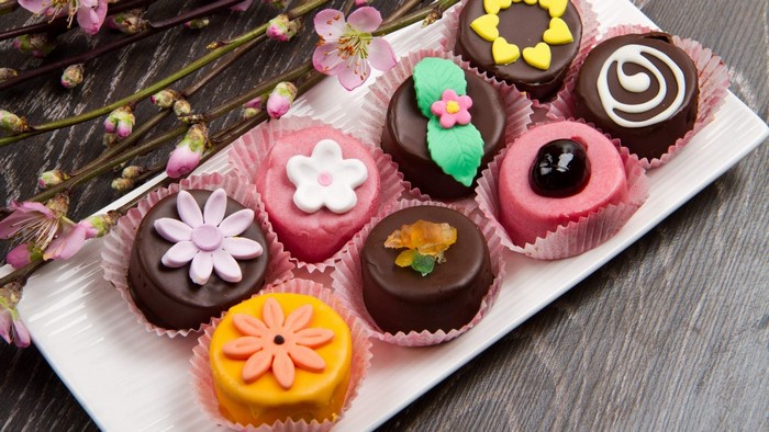 Assortment of decorated cupcakes on a platter