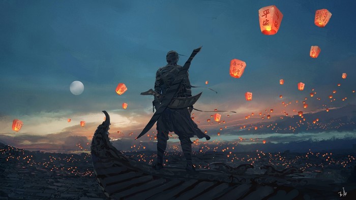 Man watching sky lanterns at dusk