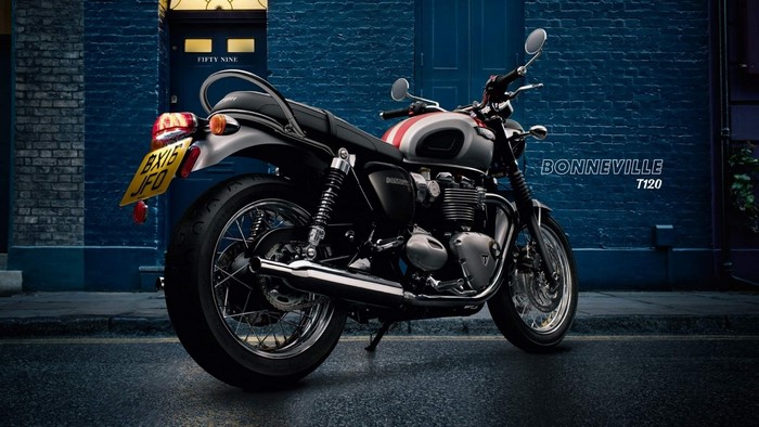 Triumph Bonneville T120 motorcycle parked outside building