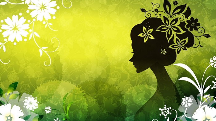 Silhouette of a woman with flowers in her hair on a green background