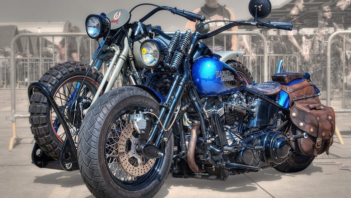 Two Harley Davidson motorcycles parked