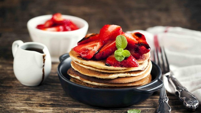 Pancakes with Strawberries and Syrup