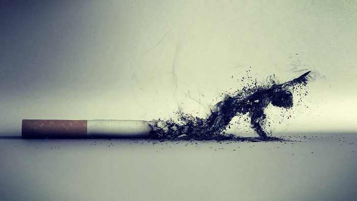 Cigarette turning into a human figure made of smoke