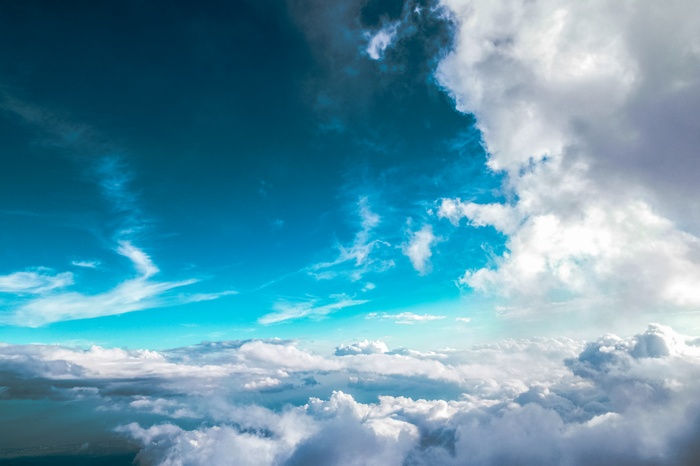 Above the Clouds in a Blue Sky