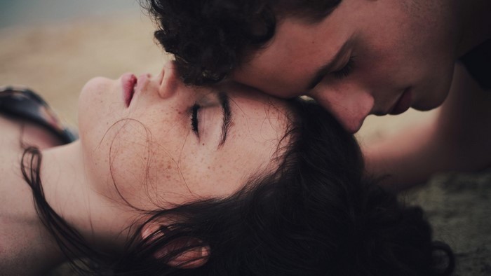 Couple lying down on beach