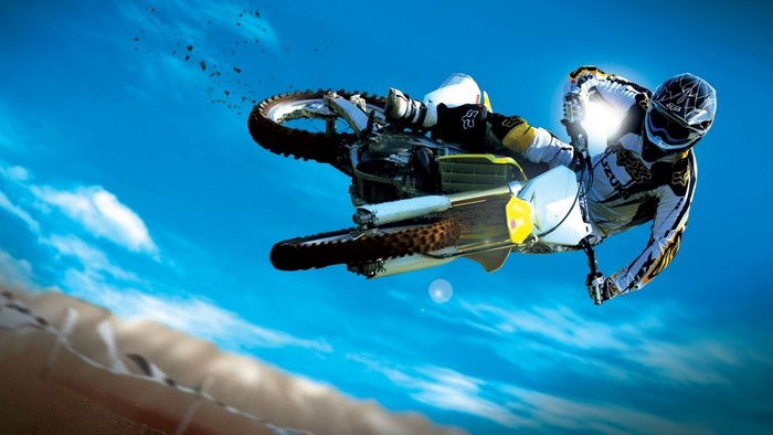 Motocross rider performing a jump on a Suzuki RM-Z450