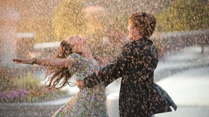 Couple dancing in the rain