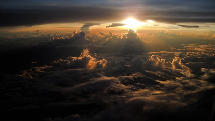 Sunset over clouds viewed from a plane