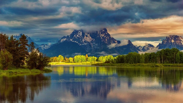 Mountain Range Reflected in River with Forest