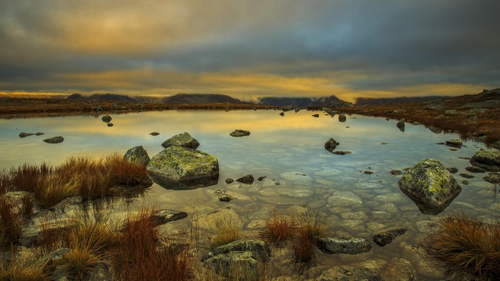 4K Mountain Lake with Rocks and Clouds