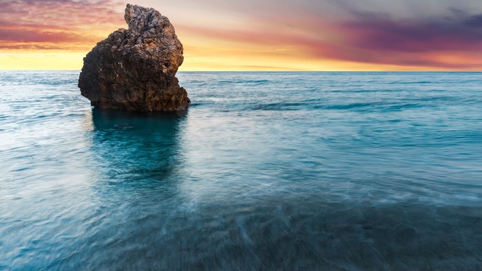 Rock in the sea at sunset, Lefkada, Greece