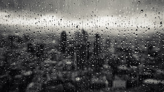 Rain Drops on Window with City View