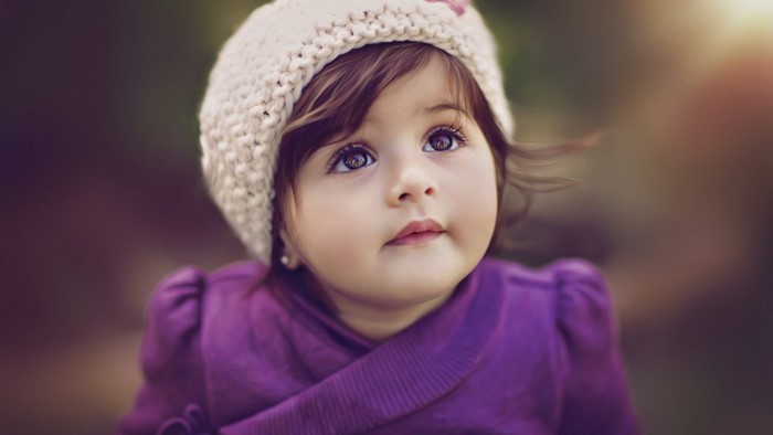Cute baby girl wearing a knitted hat