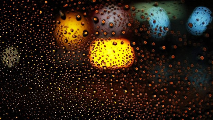 Water drops on glass with bokeh lights
