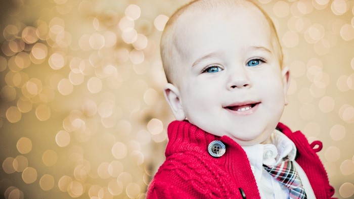 Baby boy in red sweater and tie