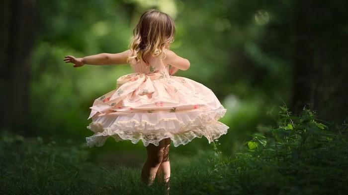 Little Girl Dancing in Forest