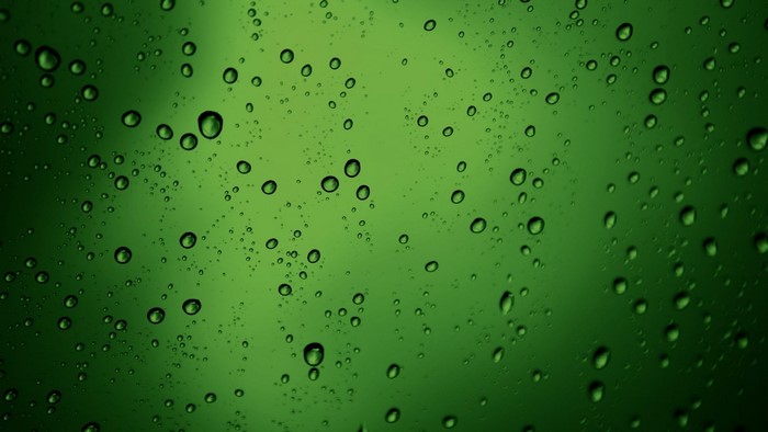 Green Water Drops on Glass