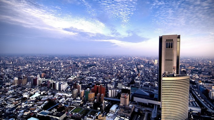Cityscape with skyscrapers and clouds
