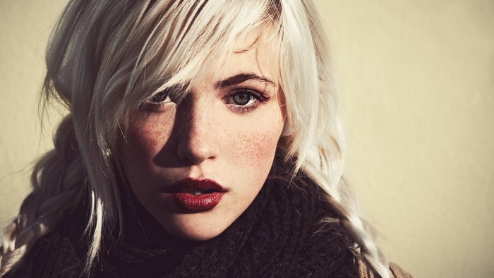 Woman with white hair and freckles