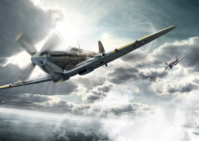 Supermarine Spitfires in flight over clouds