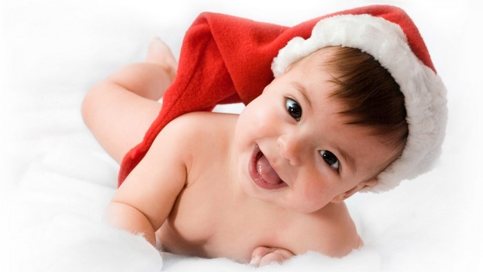 Baby wearing a Santa hat