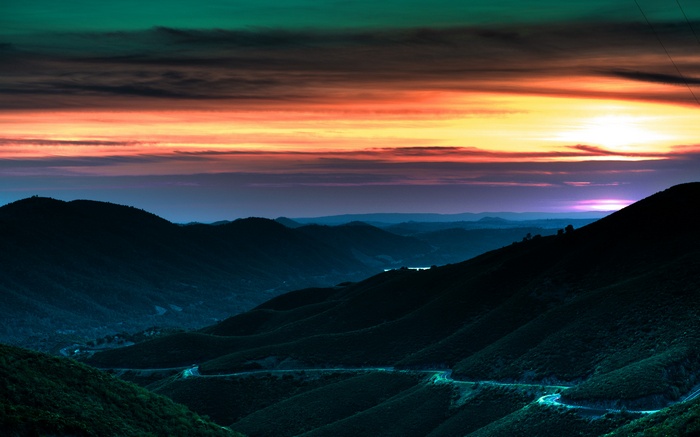 Colorful Sunset over Rolling Hills
