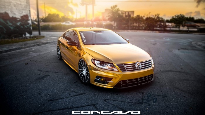 Gold Volkswagen Passat CC on asphalt road