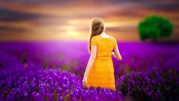 Girl in a yellow dress in a lavender field