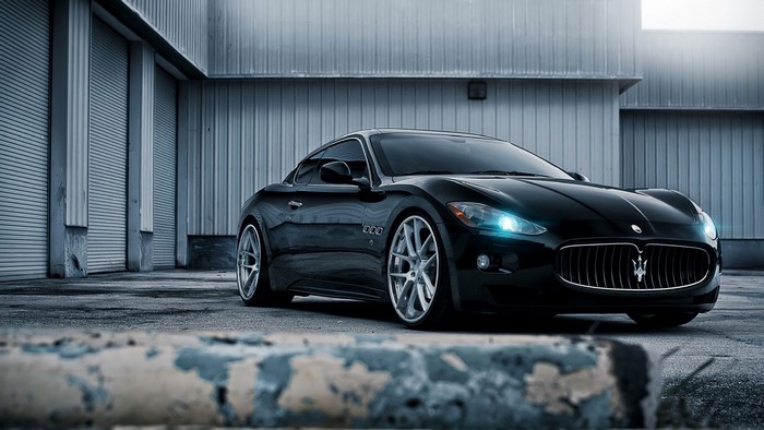 Black Maserati GranTurismo parked outside building