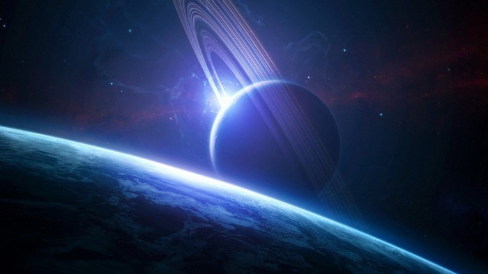 Planet with Rings and Earth in Space