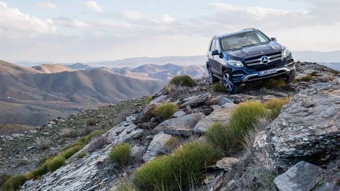 Mercedes-Benz SUV on rocky terrain