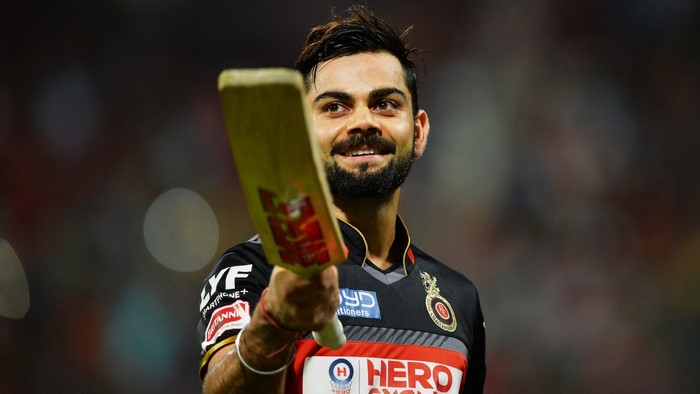 Virat Kohli holding a cricket bat