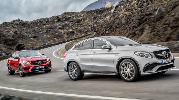 Two Mercedes-Benz GLE Coupe SUVs on a mountain road
