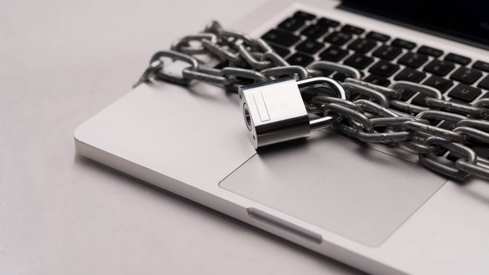 Laptop secured with a chain and padlock