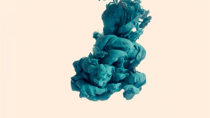 Teal ink cloud in water