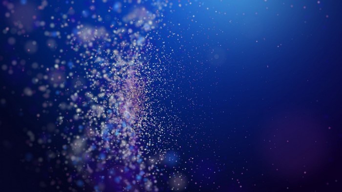 Magic Dust Particles on Blue Background