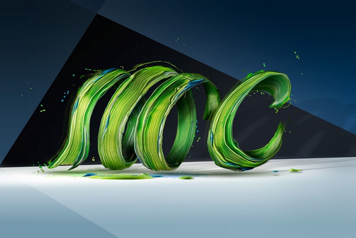 Green paint swirl on a dark background
