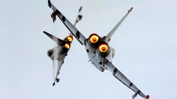 Two jet fighters in mid-air combat