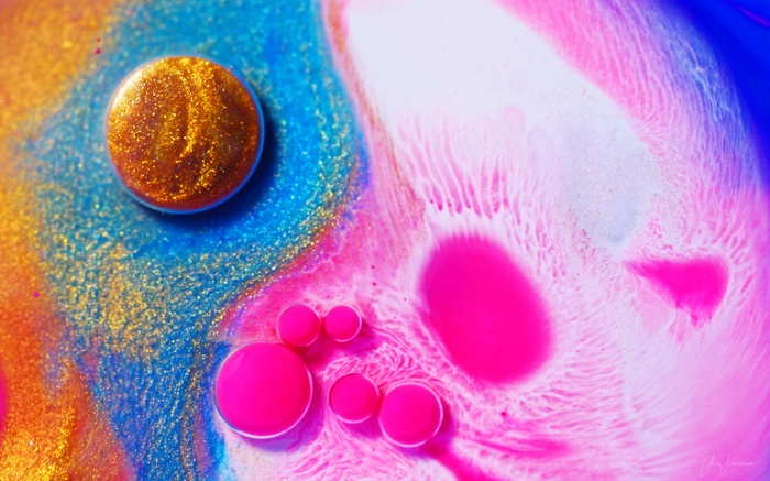 Colorful abstract fluid art with sparkles