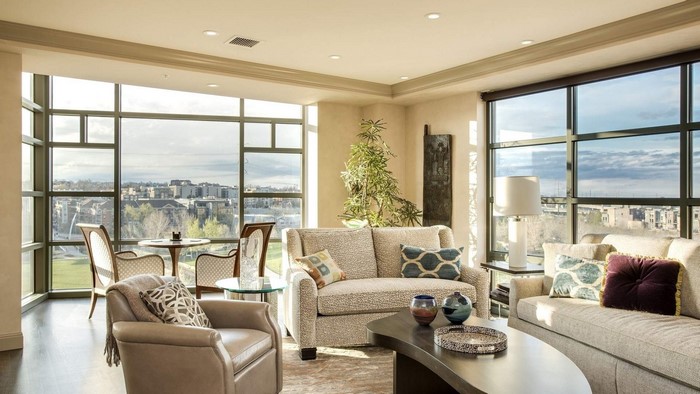 Living room with large windows and city view