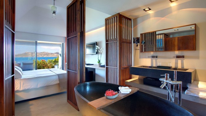 Luxury bathroom with ocean view and bedroom