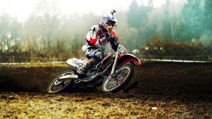 Motocross Rider on a Dirt Track