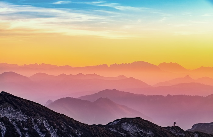 Mountain range with fog at sunset 4K
