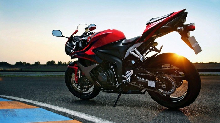 Red Honda CBR 600 RR motorcycle on a track