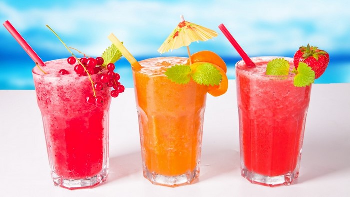 Three Fruity Drinks with Garnishes