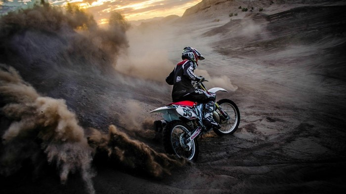 Motocross Rider in Dust Cloud