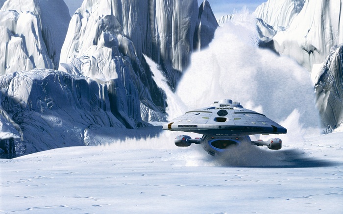 Starship landing on a snowy planet with ice mountains